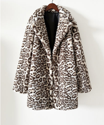 Leopard print coat on a hanger against a white background