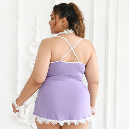 Woman wearing a lavender nightgown with white lace trim against a white curtain background