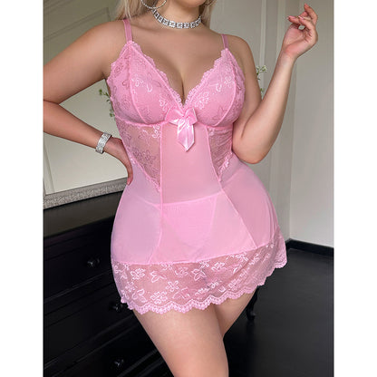 Person wearing a pink lace lingerie set in a room setting.