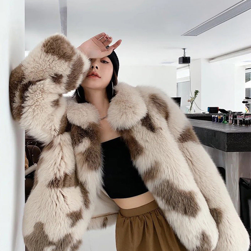 Person wearing a fur coat in an indoor setting