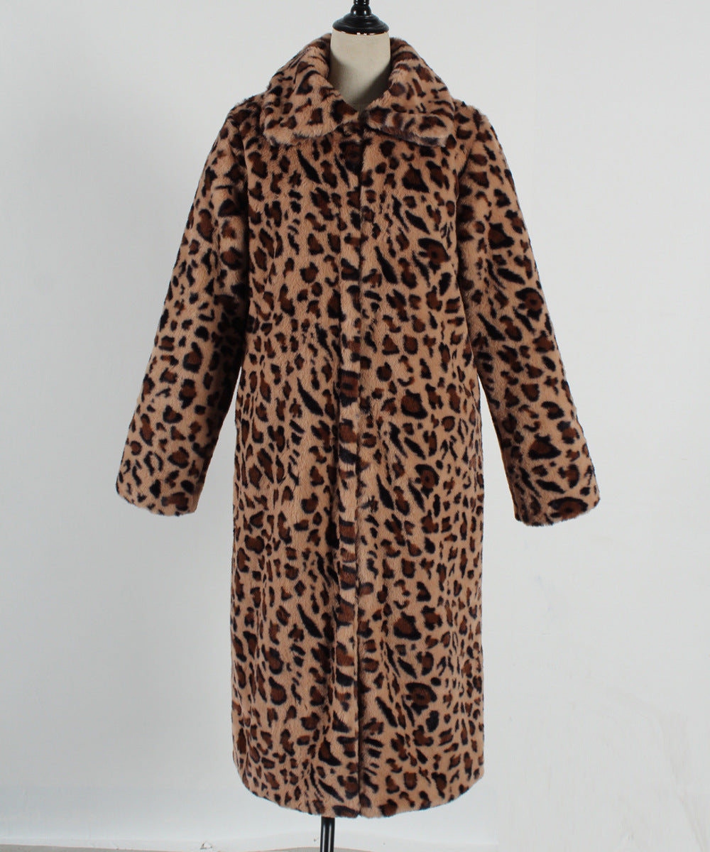 Leopard print coat on a mannequin against a white background