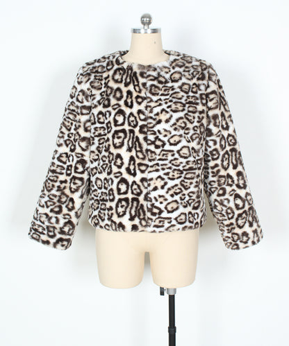 Leopard print sweater on a mannequin against a white background