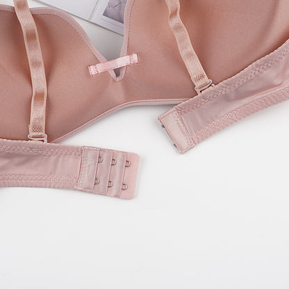 Pink bra on a white background