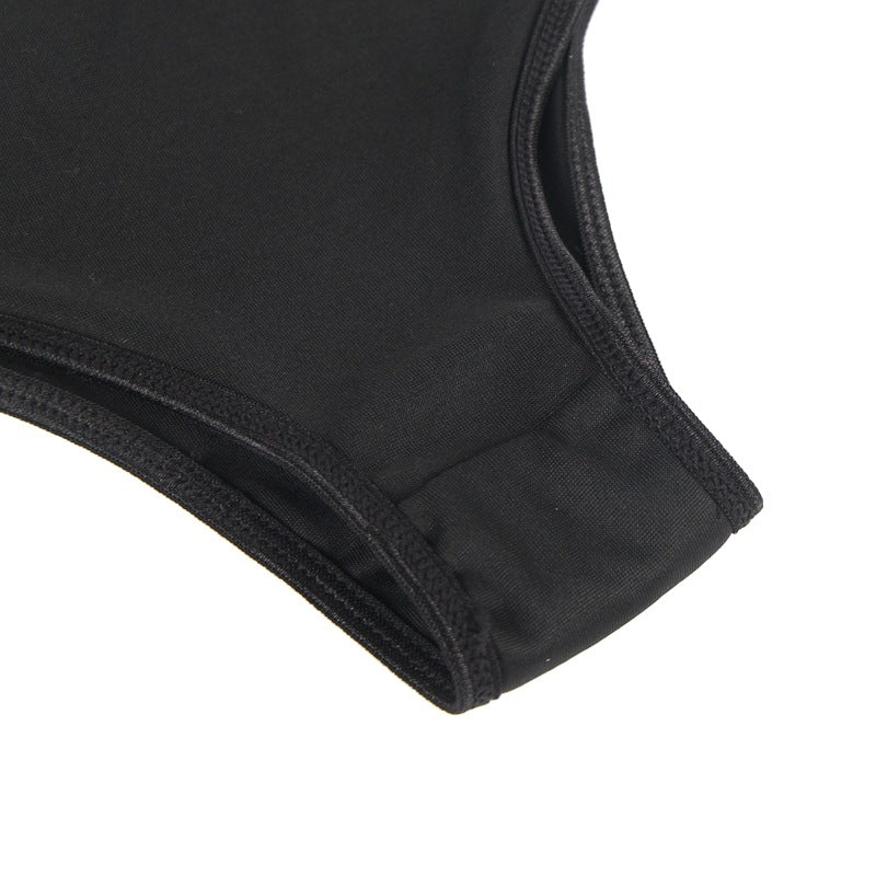 Close-up of a black swimsuit top on a white background