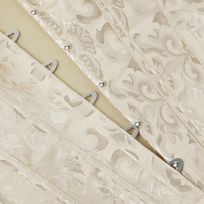 Beige lace fabric with metal hooks on a wooden board