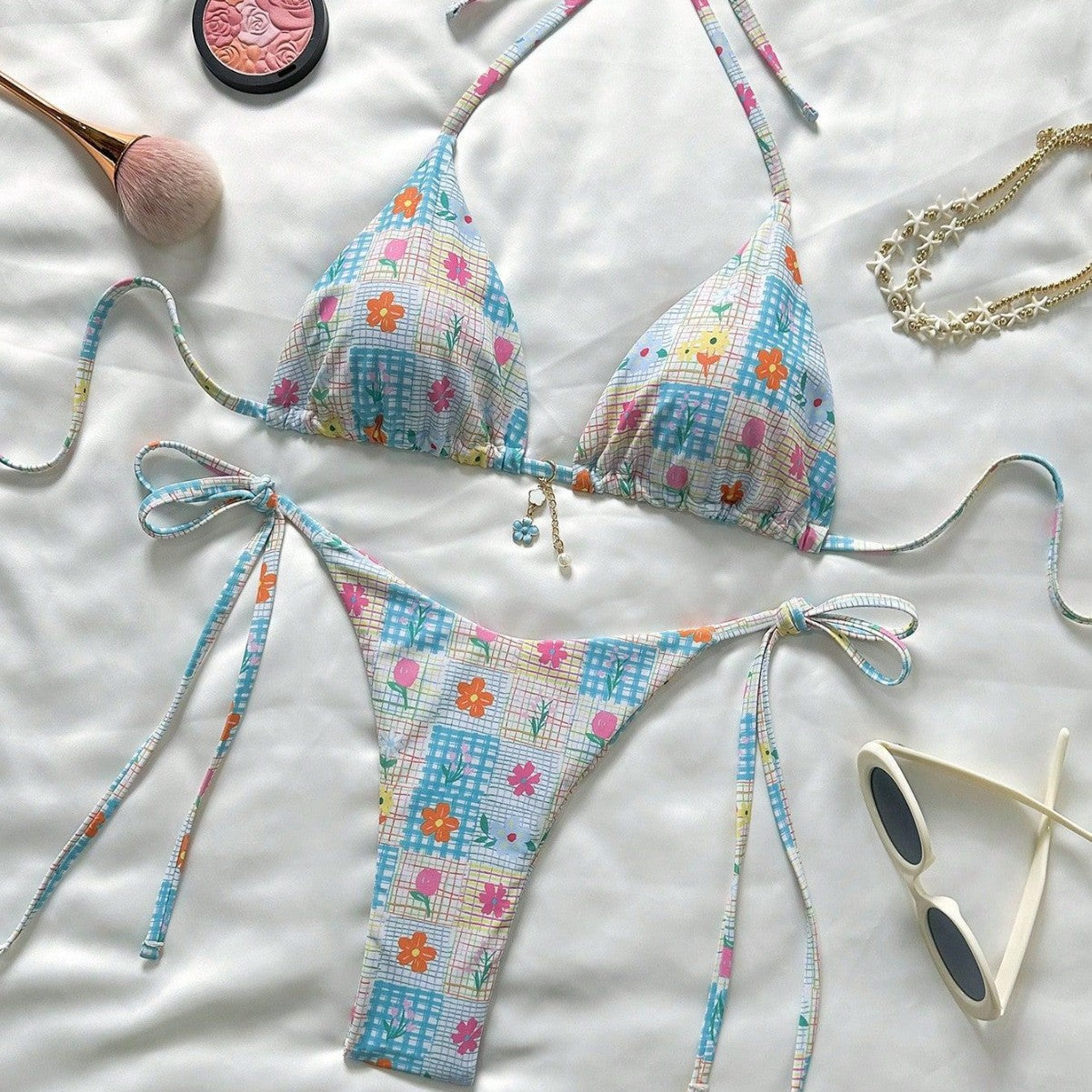 Colorful bikini set with floral pattern on a light background