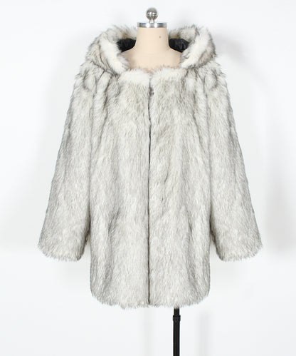 Fur coat on a mannequin against a white background