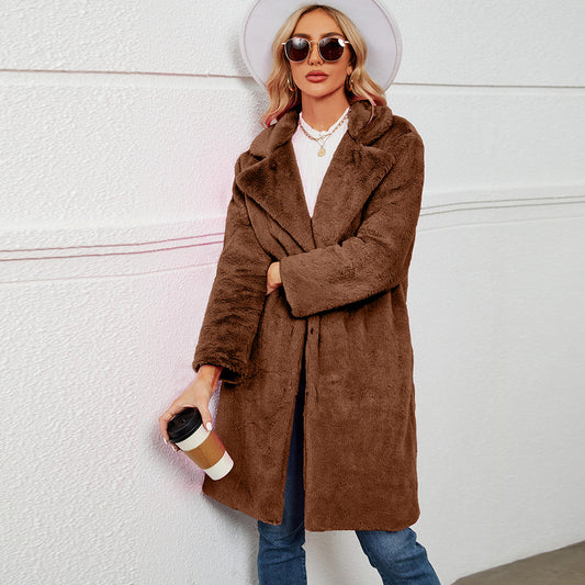 Plus-size woman wearing casual collar long faux fur coat in winter street style