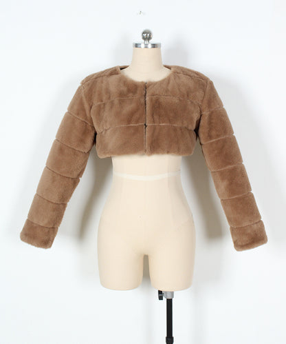 Brown fur jacket on a mannequin against a white background