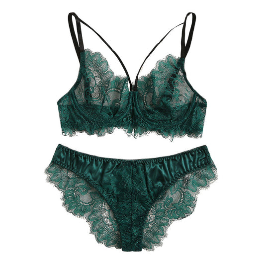Green lace lingerie set on a white background