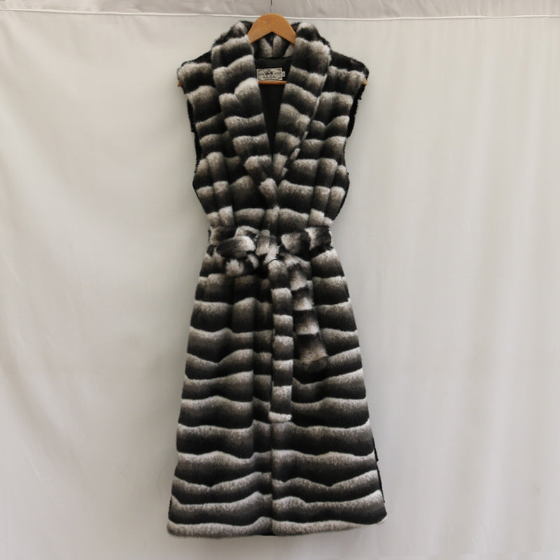 Close-up of plush mink-style fur and zebra-pattern belt on plus size coat