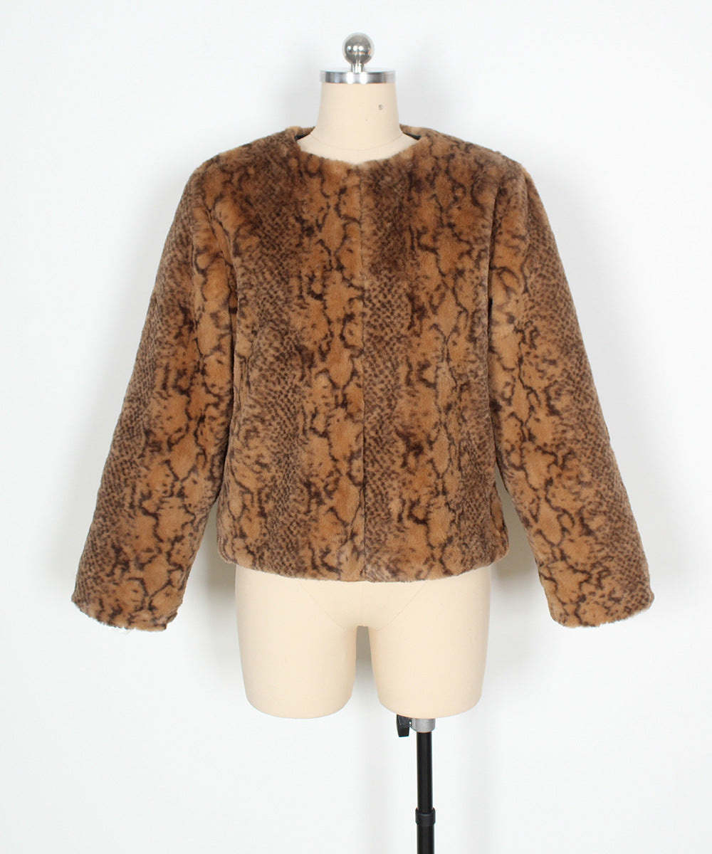 Brown snake print jacket on a mannequin against a white background