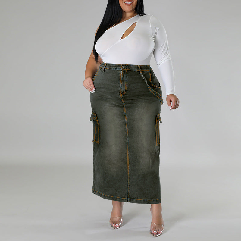 Woman wearing a white long-sleeve top and green denim skirt on a gray background plus size denim decoration sleeveless split skirt women jeans in trend