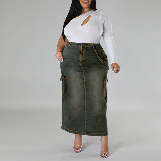 Woman wearing a white long-sleeve top and green denim skirt on a gray background plus size denim decoration sleeveless split skirt women jeans in trend