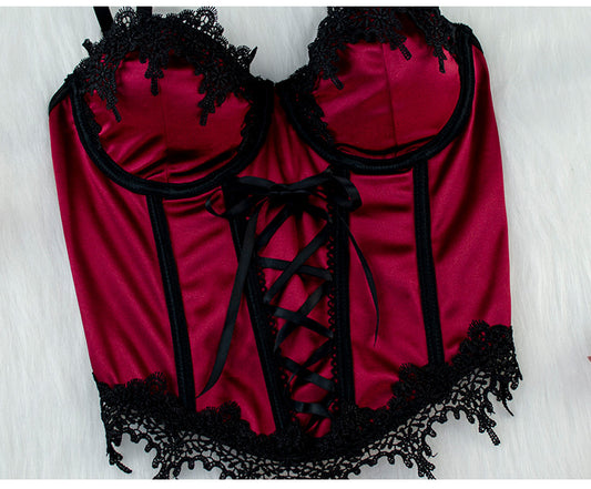 Red lingerie set with black lace details on a white background