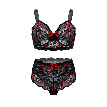 Black lace lingerie set with red accents on a white background