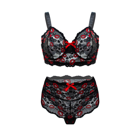 Black lace lingerie set with red accents on a white background