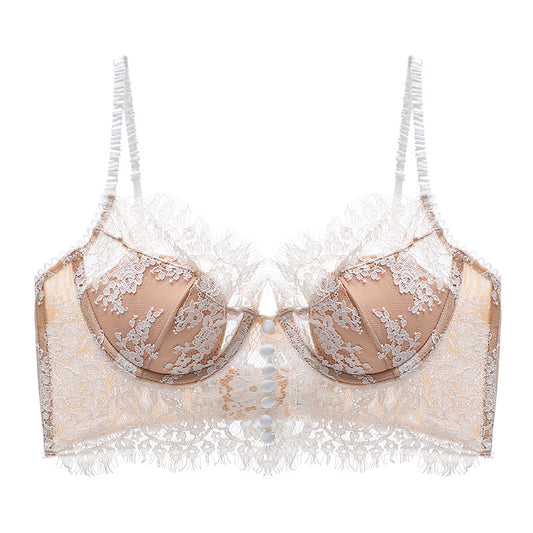 Beige bra with lace detailing on a white background