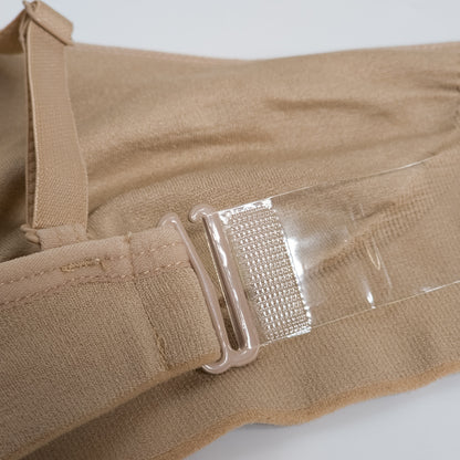 Tan fabric with a clear plastic buckle on a white background