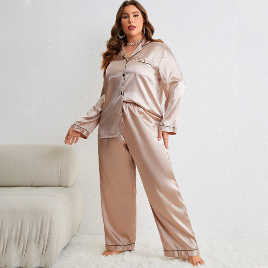 Woman wearing a satin pajama set on a white background
