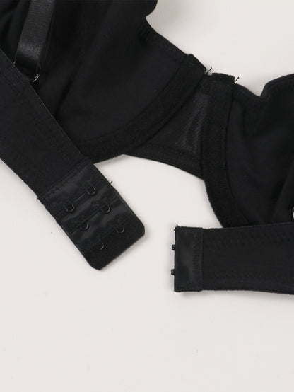 Black bra with straps on a white background