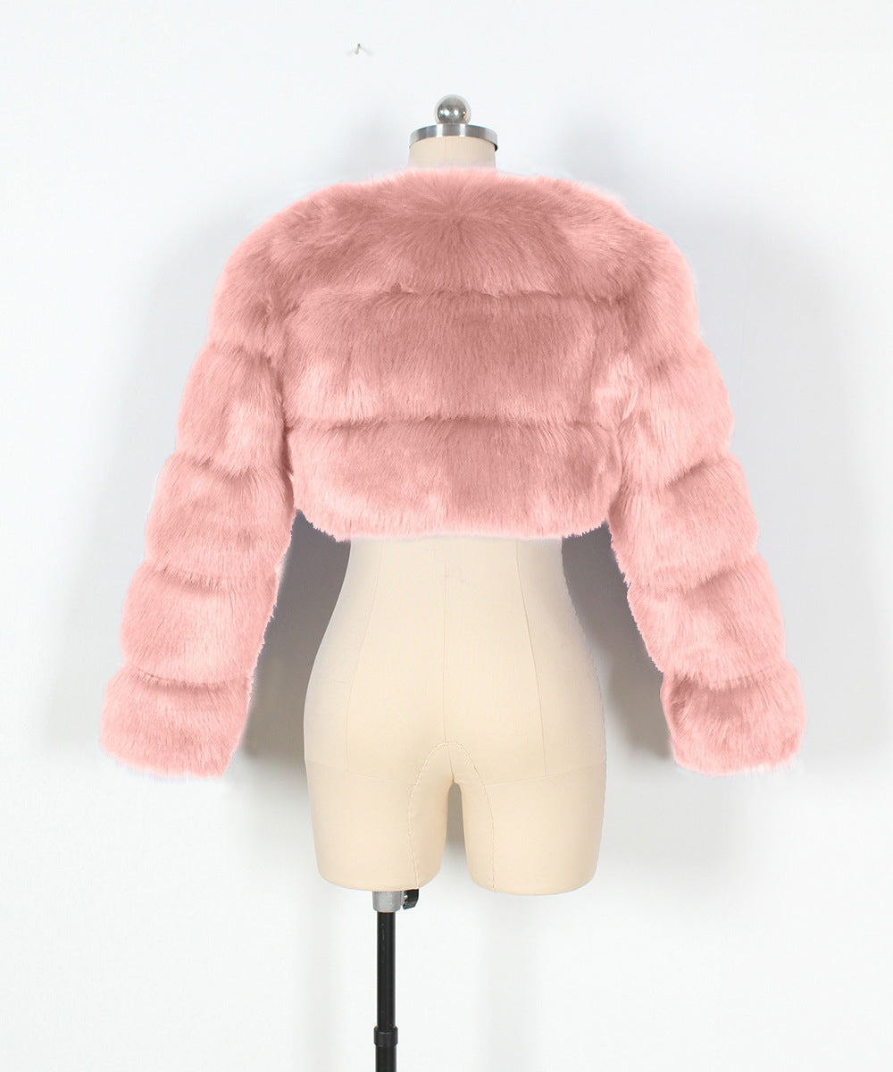 Pink faux fur jacket on a mannequin against a white background