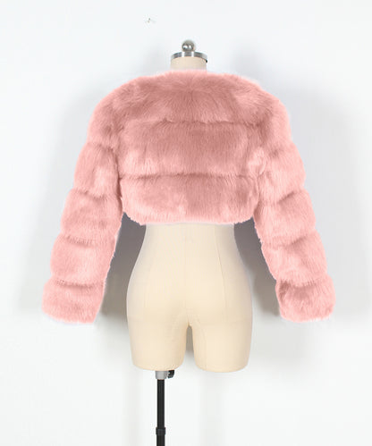 Pink faux fur jacket on a mannequin against a white background