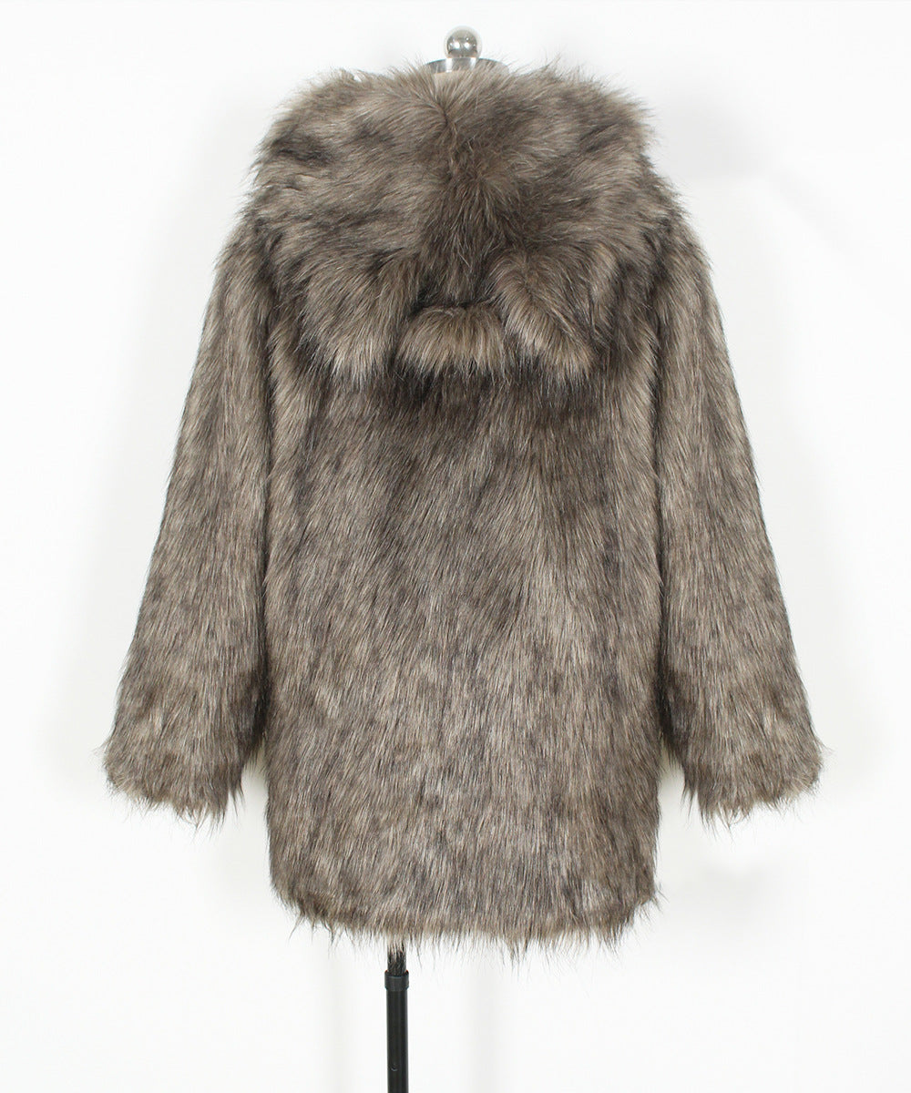 Fur coat with a hood on a mannequin against a white background