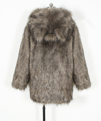 Fur coat with a hood on a mannequin against a white background