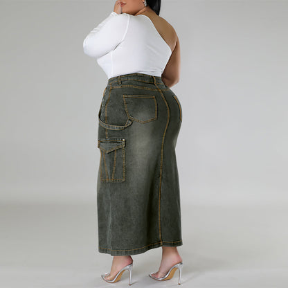 Person wearing a long denim skirt and white top on a plain background plus size denim decoration sleeveless split skirt women jeans in trend