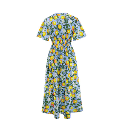 Dress with lemon and floral pattern on a white background