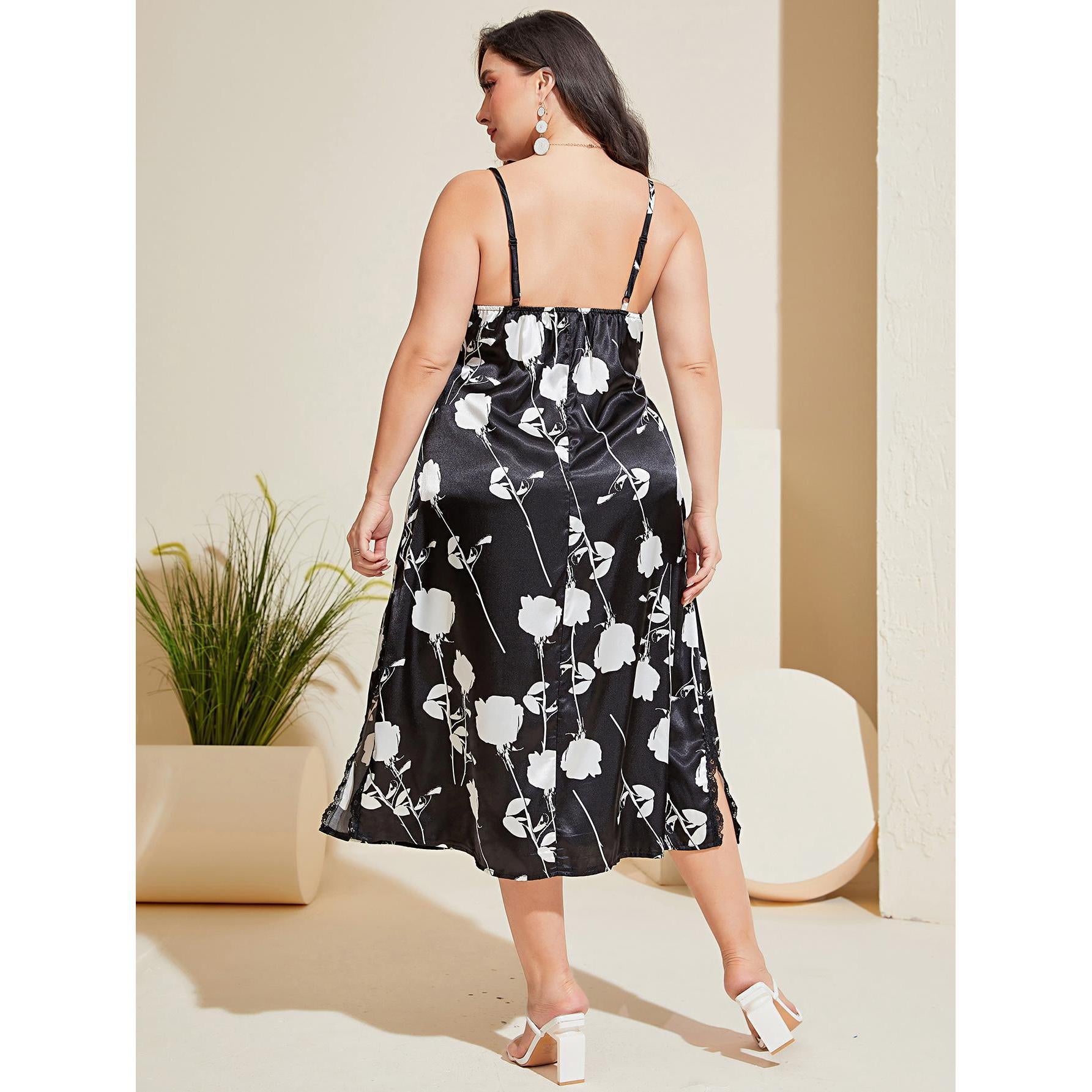 Woman wearing a black floral dress in an indoor setting