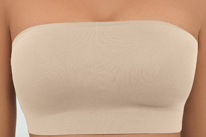 Beige strapless top worn by a person with a blurred background
