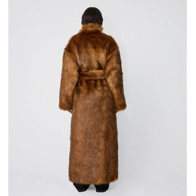 Brown fur coat worn by a person on a white background
