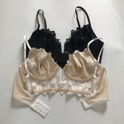Black and beige bras with lace details on a white background