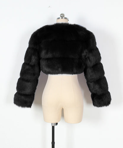 Black fur jacket on a mannequin against a white background
