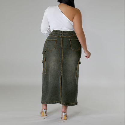 Person wearing a green denim skirt on a plain background plus size denim decoration sleeveless split skirt women jeans in trend