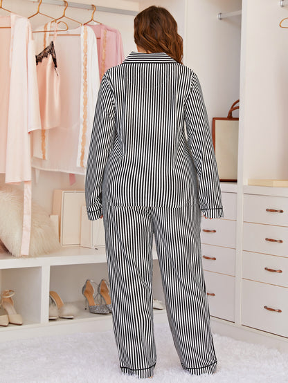 Person wearing a black and white striped pajama set in a bedroom.