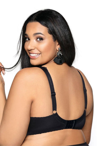“Back view showing lace bavette, smooth stretch knit, and adjustable straps”