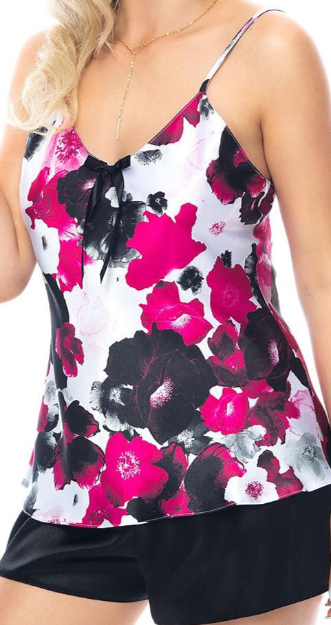 Plus size woman wearing printed tank top and solid shorts pajama set